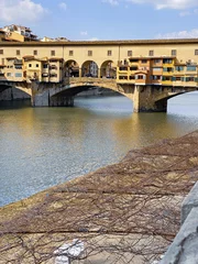 Papier Peint photo Ponte Vecchio View from the Ponte Vecchio over the Arno river, in the ancient medieval city of Florence, Italy.