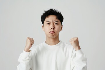 Modern Magazine Cover Featuring Handsome Asian Korean Man in White Sweatshirt Expressing Anger,...