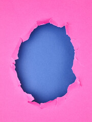 Ripped pink paper with hole in the center - 785415685