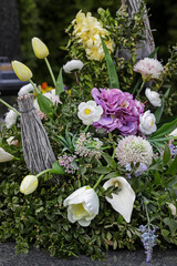 Detail of Easter decoration with mixed artificial and fresh flowers.