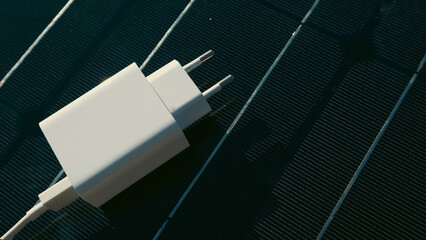 Mobile Phone Chargers on Photovoltaic sells. Concept of sustainable lifestyle and green renewable...