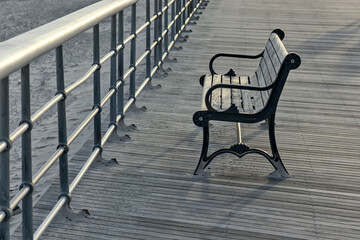 bench on the boardwalk at the beach (jones beach state park on long island nassau county new york)...