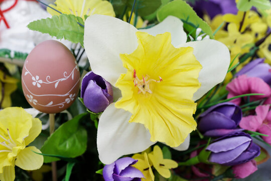 Beautiful Easter decoration with artificial flowers.