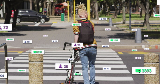Image of notification bars over albino african american man crossing street with bicycle