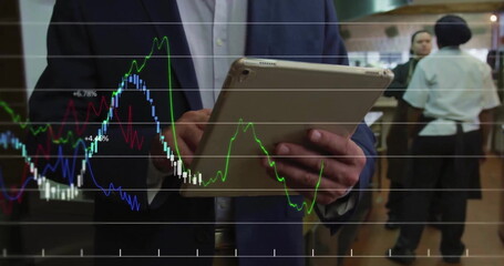 Image of financial data processing over biracial businessman using tablet