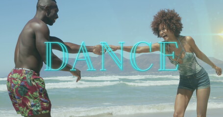 Image of dance text over smiling african american couple dancing at beach