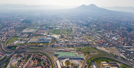 Naples, Italy. Volcano Vesuvius in backlight. Panorama of the city on a summer day. Sunny weather. Aerial view