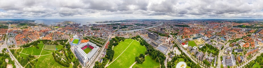 Fototapeta na wymiar Copenhagen, Denmark. Panorama of the city in summer. Cloudy weather. Panorama 360. Aerial view