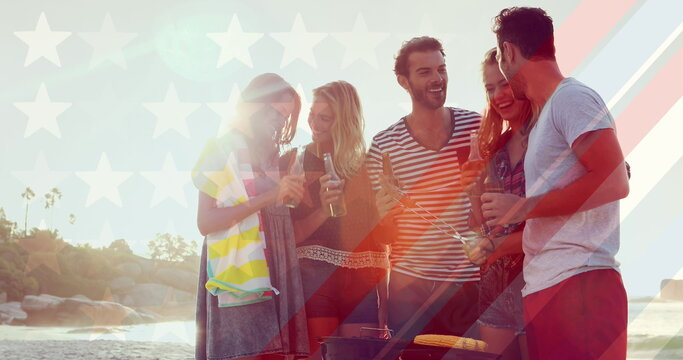 Naklejki Image of flag of usa over diverse group of friends drinking beer outdoors