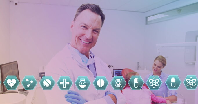 Image of diverse icons over happy senior caucaisan lab worker looking at camera