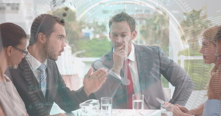 Image of scope scanning and data processing over diverse business people