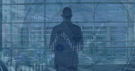 Image of financial graphs over back view of caucasian businessman with suitcase