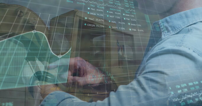 Image of financial data and graphs over midsection of caucasian businessman using smartwatch