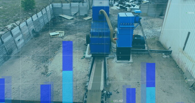 Image of financial data and graphs over machines on junkyard