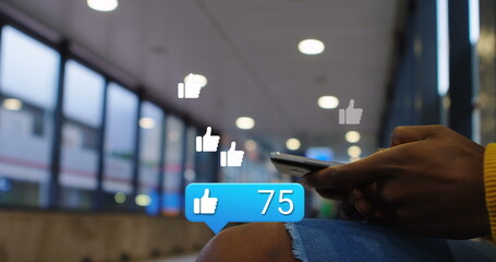 Image of digital icons over man using smartphone