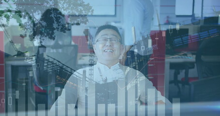 Image of data processing over asian businessman smiling