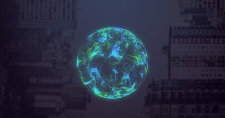 Image of globe made of shapes rotating over computer hardware