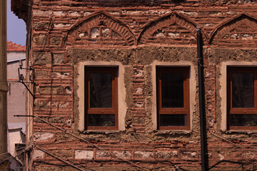 Elements of architectural decorations of buildings, old windows and window openings, arches and patterns. On the streets in Turkey, public places.
