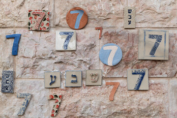 The number seven in various ceramic tiles as well as the Hebrew word for 