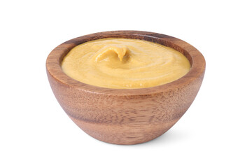 Fresh tasty mustard sauce in wooden bowl isolated on white