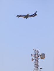 passenger plane in the blue sky - 785452261
