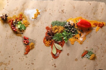 World map of different spices and products on table, top view