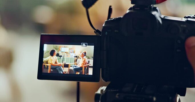 Video, camera and live recording with interview for podcast, talk show or career news at the studio. People in online streaming, vlog or broadcast with journalist, host and guest speaker in lounge