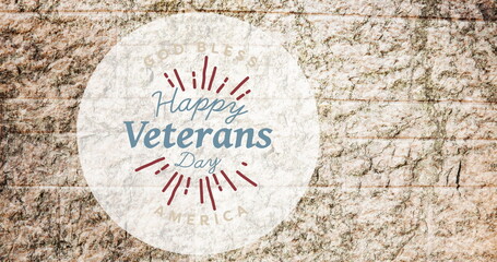 Obraz premium Image of happy veterans day in circle over stone wall