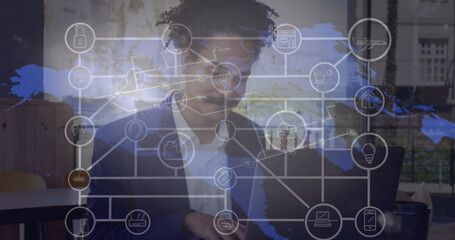 Image of network of connections with world map over african american man using laptop