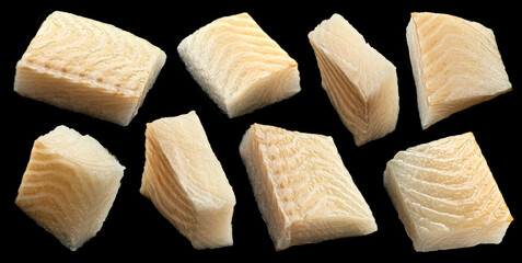 Fresh fish fillet pieces on black background