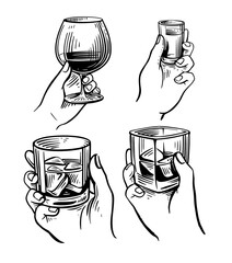 Hands holding various glasses. Whiskey and cognac - 785471276
