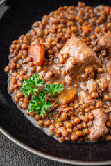 lentils with meat beef or pork fresh cooking appetizer meal food snack on the table copy space food background rustic