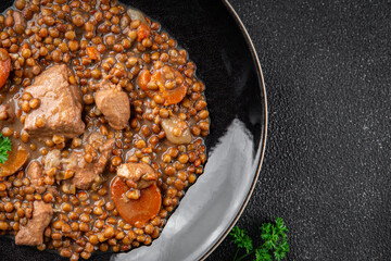lentils with meat beef or pork fresh cooking appetizer meal food snack on the table copy space food background rustic