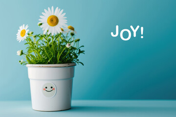 A daisy in a pot and a sticker with a picture of a happy face