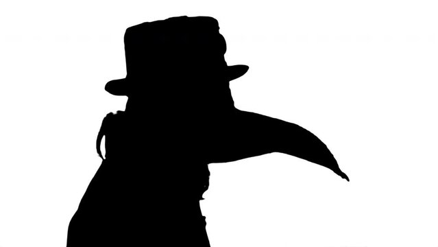 Creepy Masked Silhouette Man Costume Figure Psycho Profile Close Up. Silhouette of a face profile shot of a weird psycho masked man with a strange costume