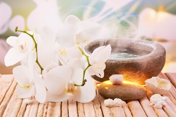 Spa setting with spa stones and white orchids