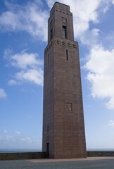 Brest, France - Apr 7, 2024: US Naval Monument. People walking in Brest. Streets and buildings. Lifestyle in the urban area. Sunny spring day. Selective focus