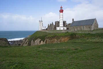Fototapeta na wymiar Plougonvelin, France - Apr 7, 2024: Wonderful landscapes in France, Brittany. Saint-Mathieu lighthouse in Plougonvelin. Sunny spring day. Selective focus.