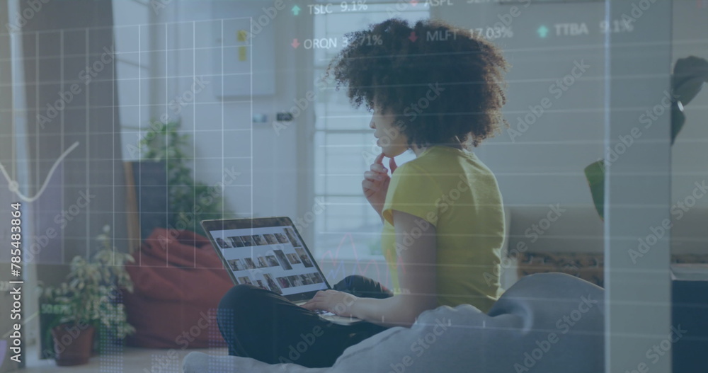 Poster image of financial data processing over biracial businesswoman using computer