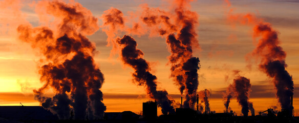 Factory Pumping Pollution Into Air Smokestack Environment Emissions at Sunset