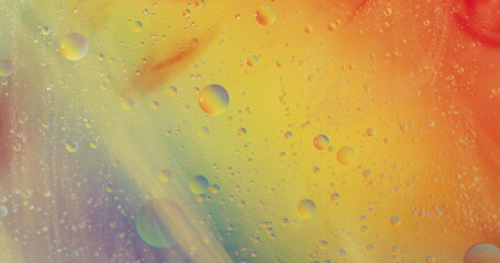 Image of elements over bubbles and colorful liquid