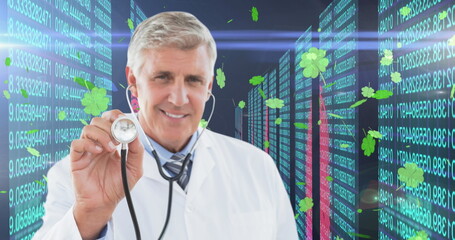 Image of data processing and clovers over caucasian male doctor