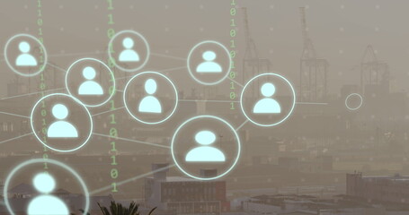Image of network of connections with icons and binary coding over cityscape