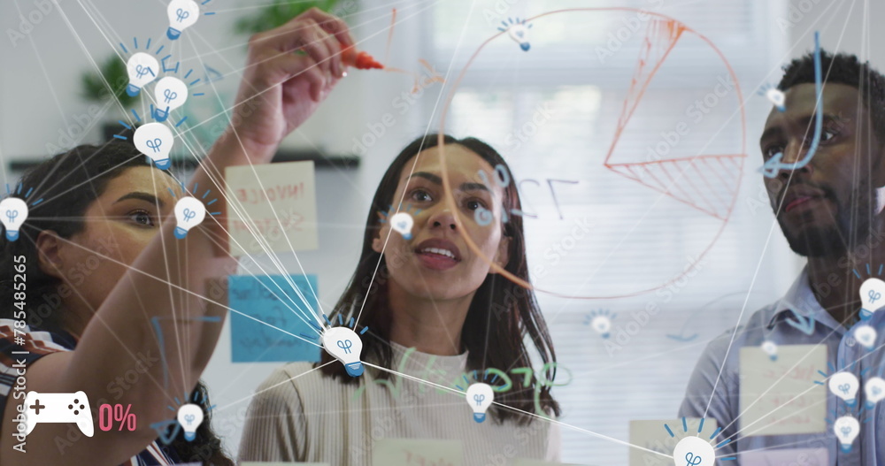 Poster Image of connected light bulbs over diverse colleagues discussing over glass wall in office