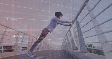 Image of graphs and circle with grid over biracial woman in hijab stretching on footbridge