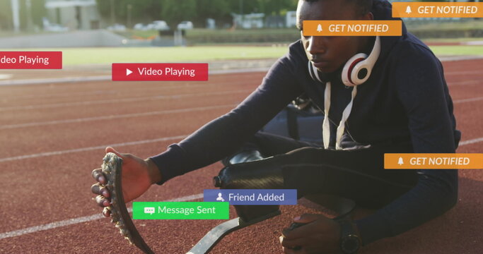 Image of text in notification bars over african american athlete stretching in race track