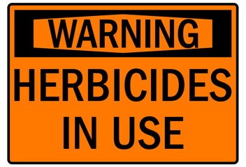 Farm safety sign herbicide in use