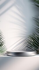 Silver background with shadows of palm leaves on a silver wall, an empty table top for product presentation