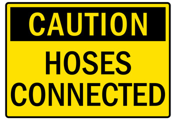 Railroad warning sign hoses connected