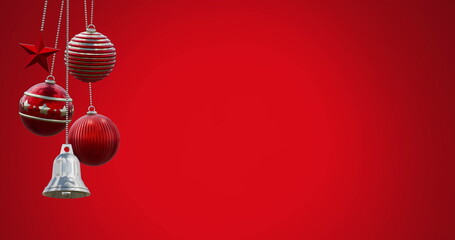 Image of swinging baubles and bell against red background